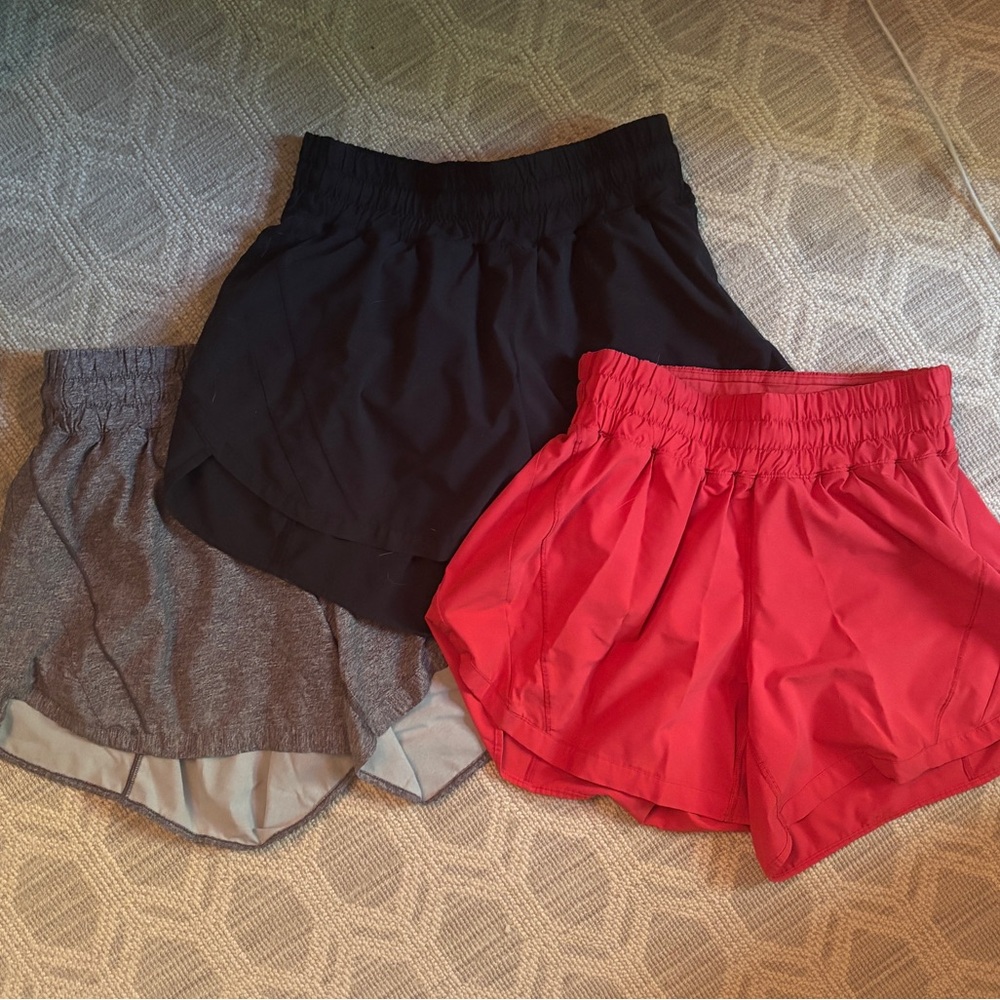 Lot of lululemon Run Times Shorts Black, Gray, and Red